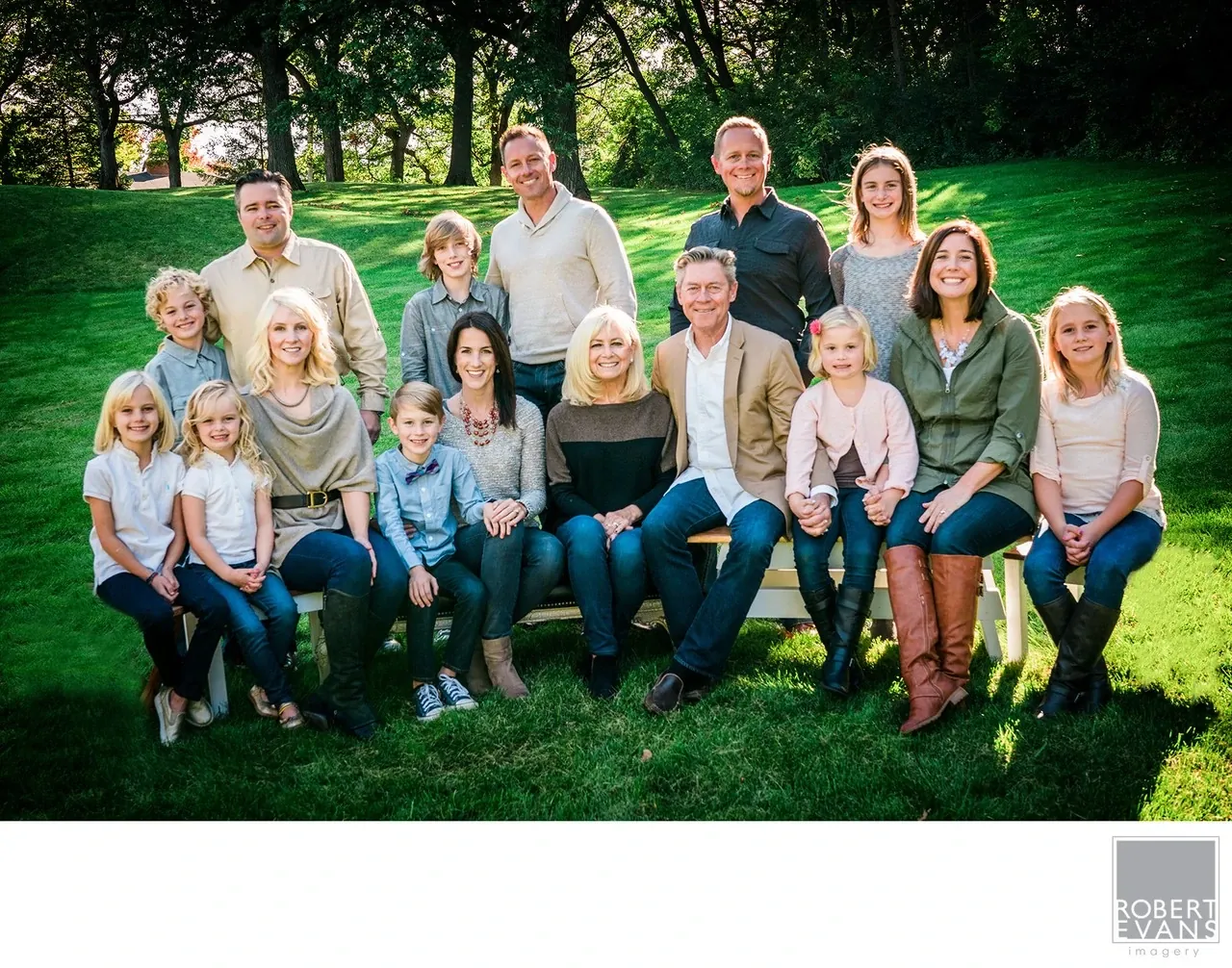 A relaxed outdoor portrait bringing several generations of one family together, creating a meaningful photograph designed to become part of the family's history.
