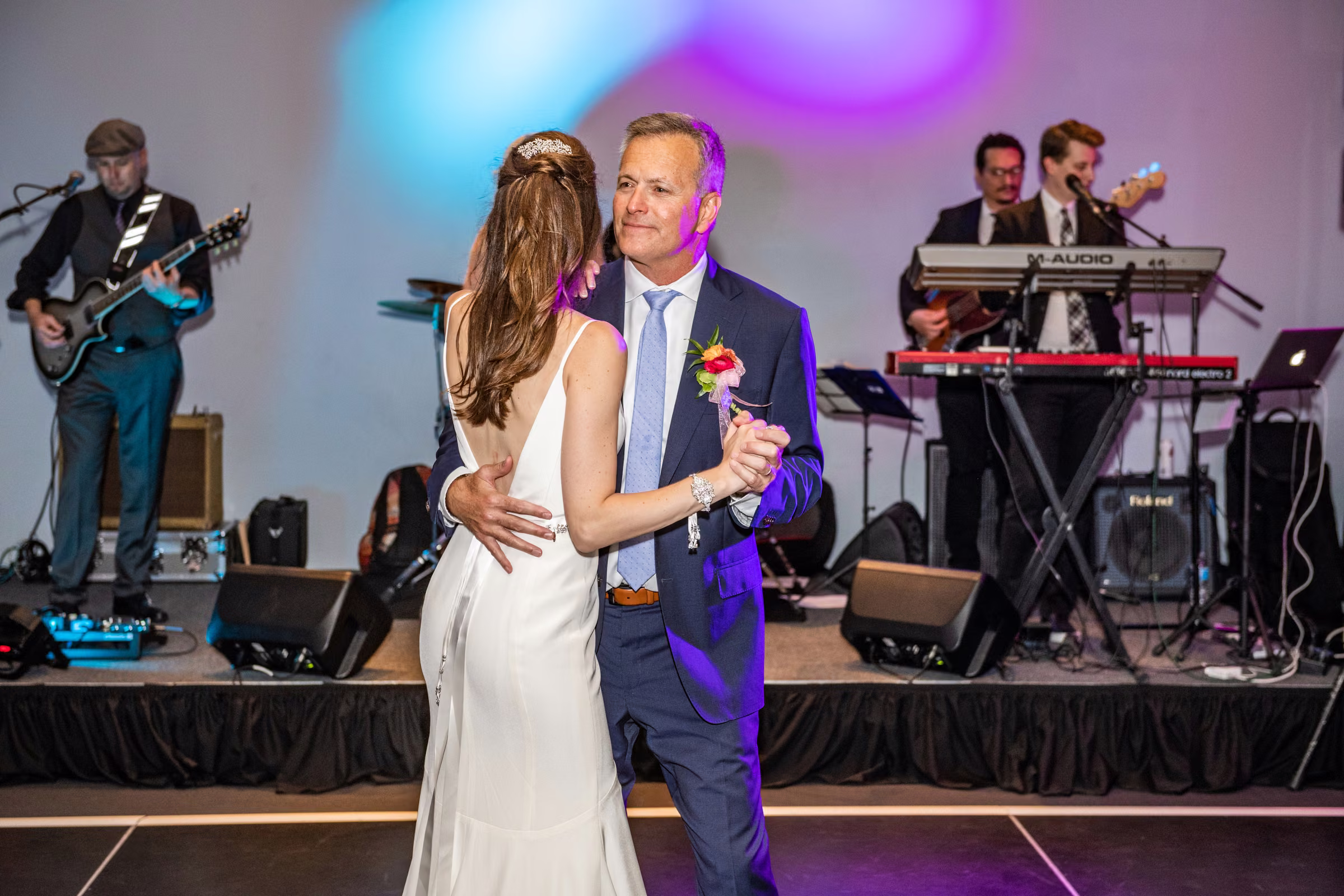 Ali dances with her father, Don Lucia, while the band plays behind them