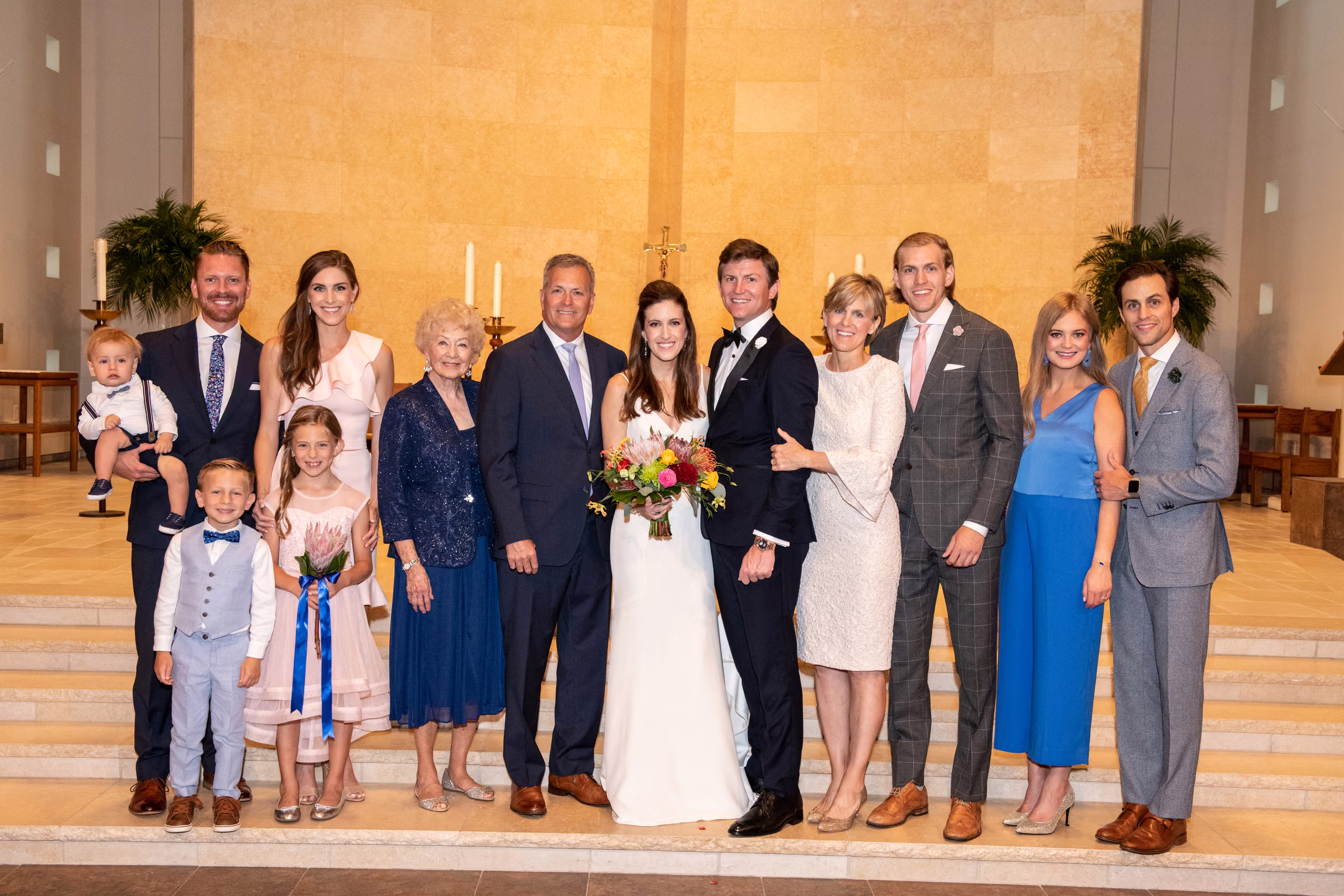 Ali and Drew pose with the Lucia family at the front of St. Bartholomew Catholic Church