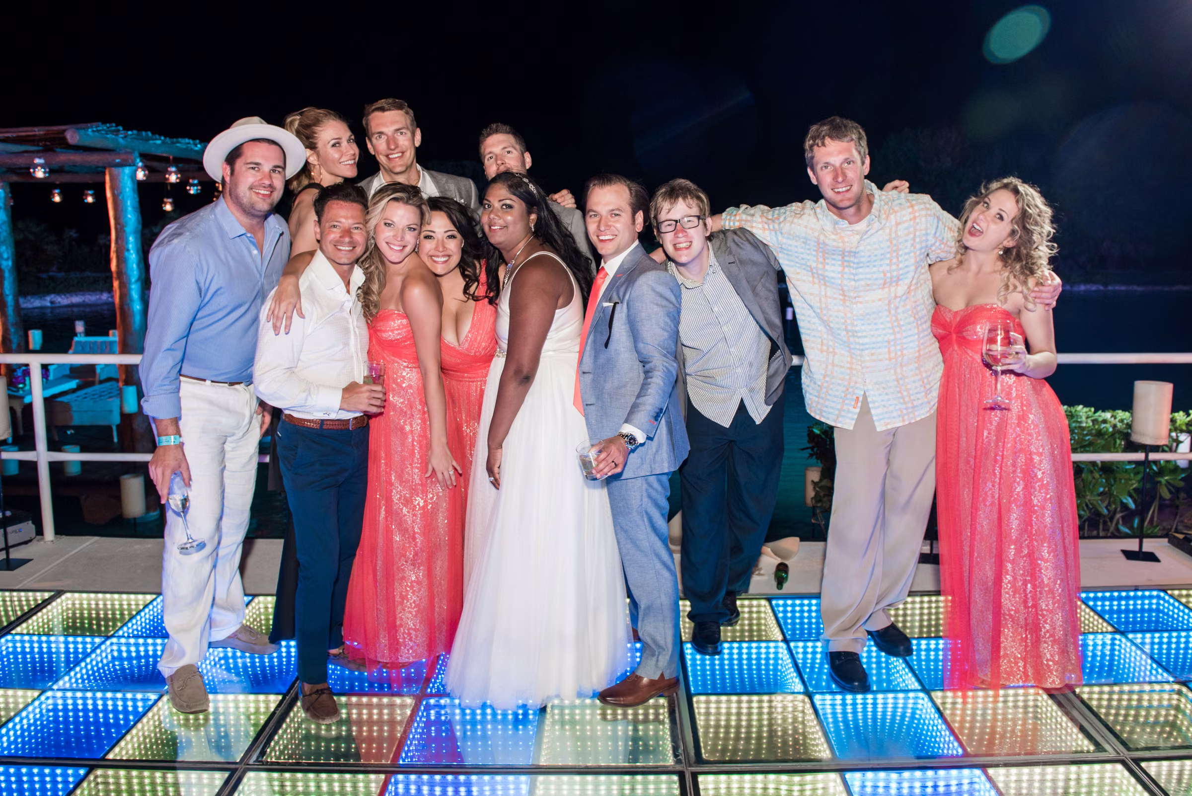 Avanti and Tony gather with close friends on the illuminated dance floor at night