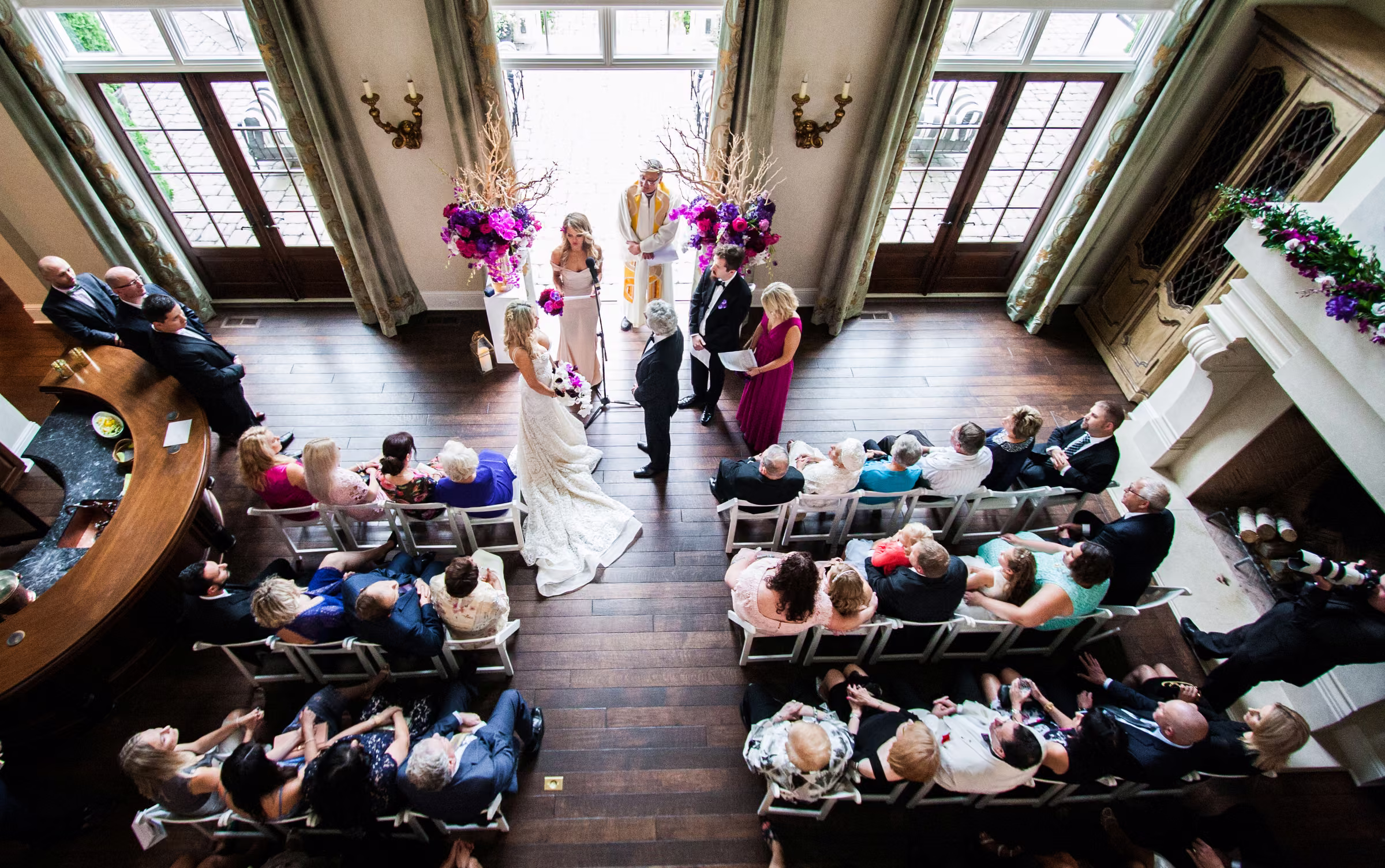 An overhead view shows Bill and Daiva’s intimate wedding ceremony inside their home