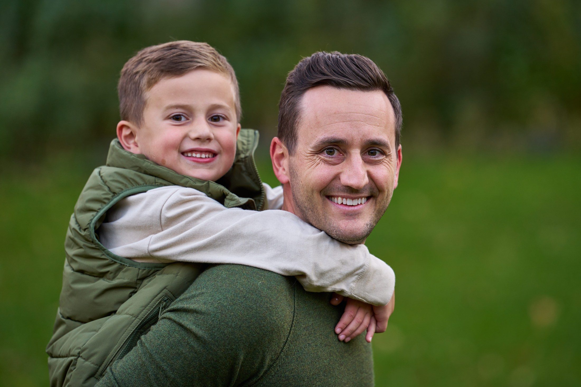 Jon Engle giving his son a piggyback ride in their backyard in Orono, Minnesota