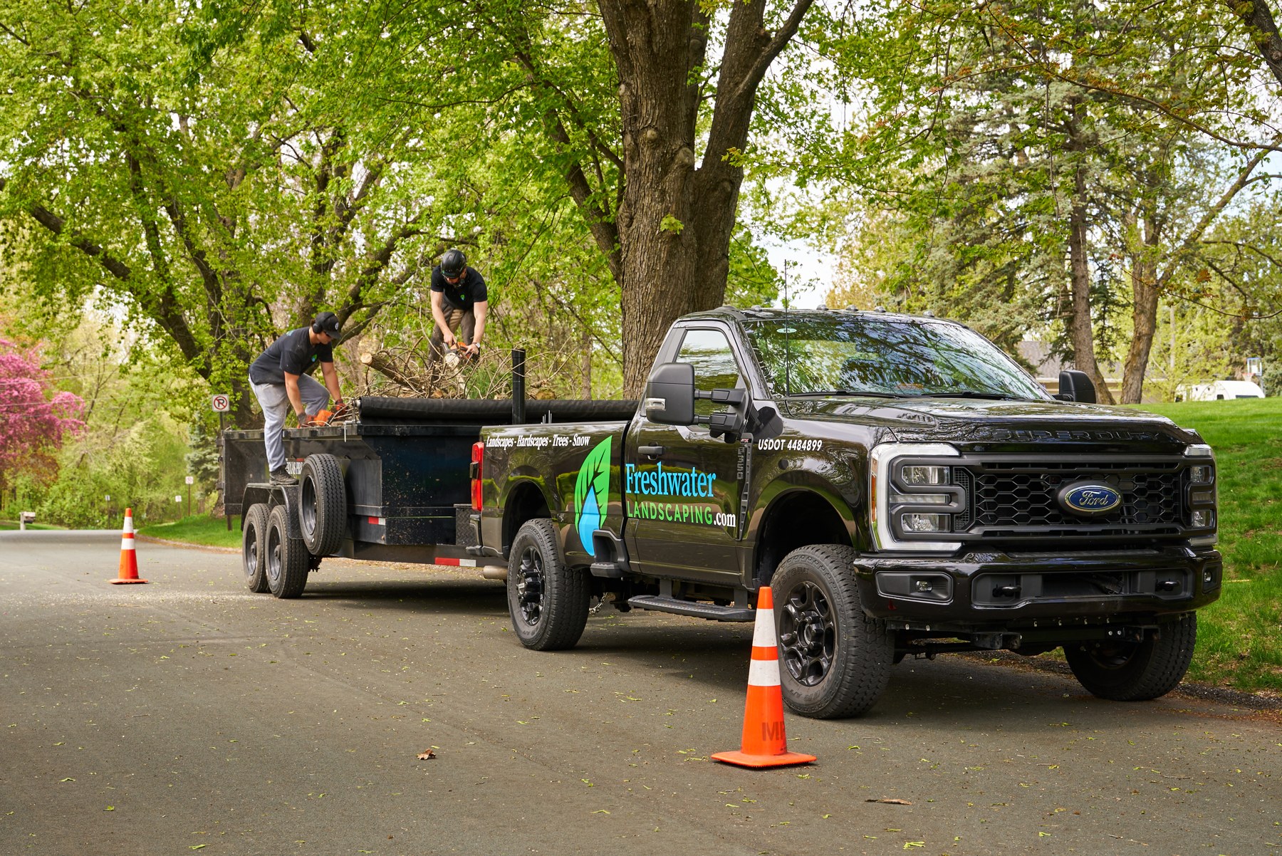 Freshwater Landscaping truck and crew during tree work