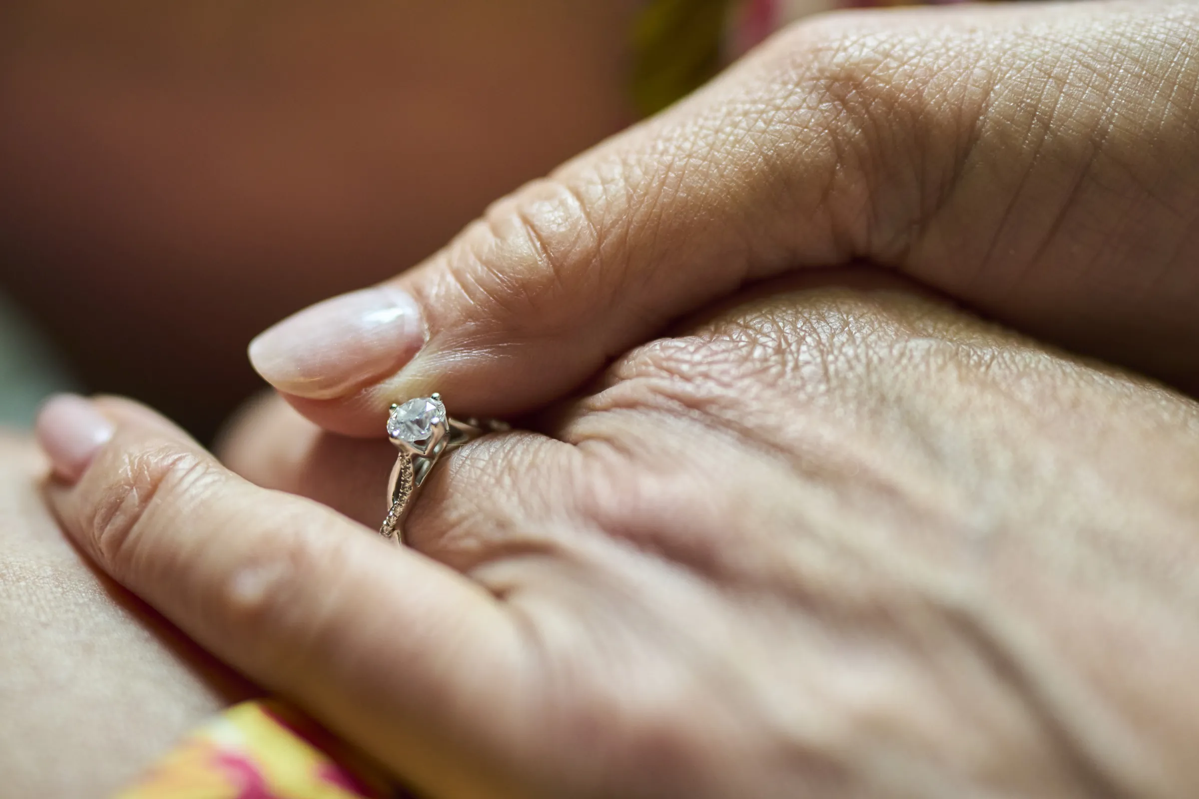A close photograph of an engagement ring on a woman’s hand, Ashery Lane Farm, Mayer, Minnesota