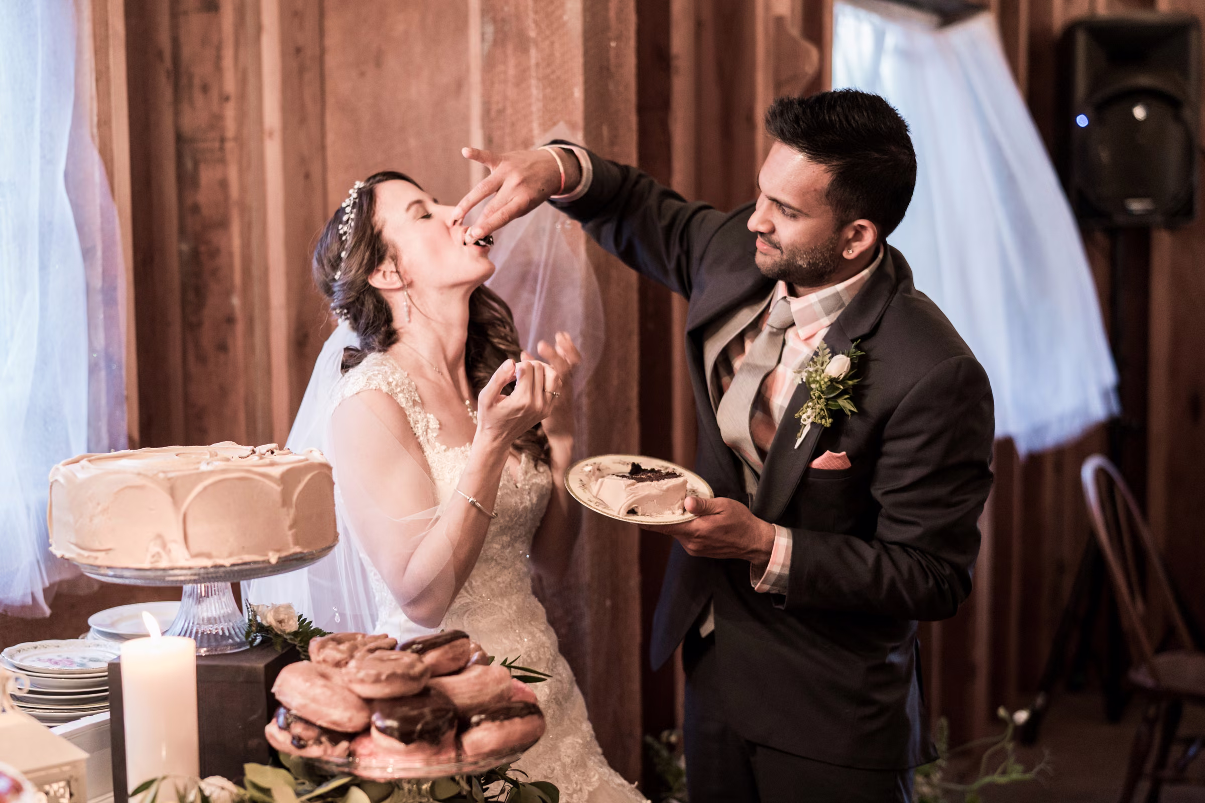 Kash feeds Kohleen a bite of wedding cake