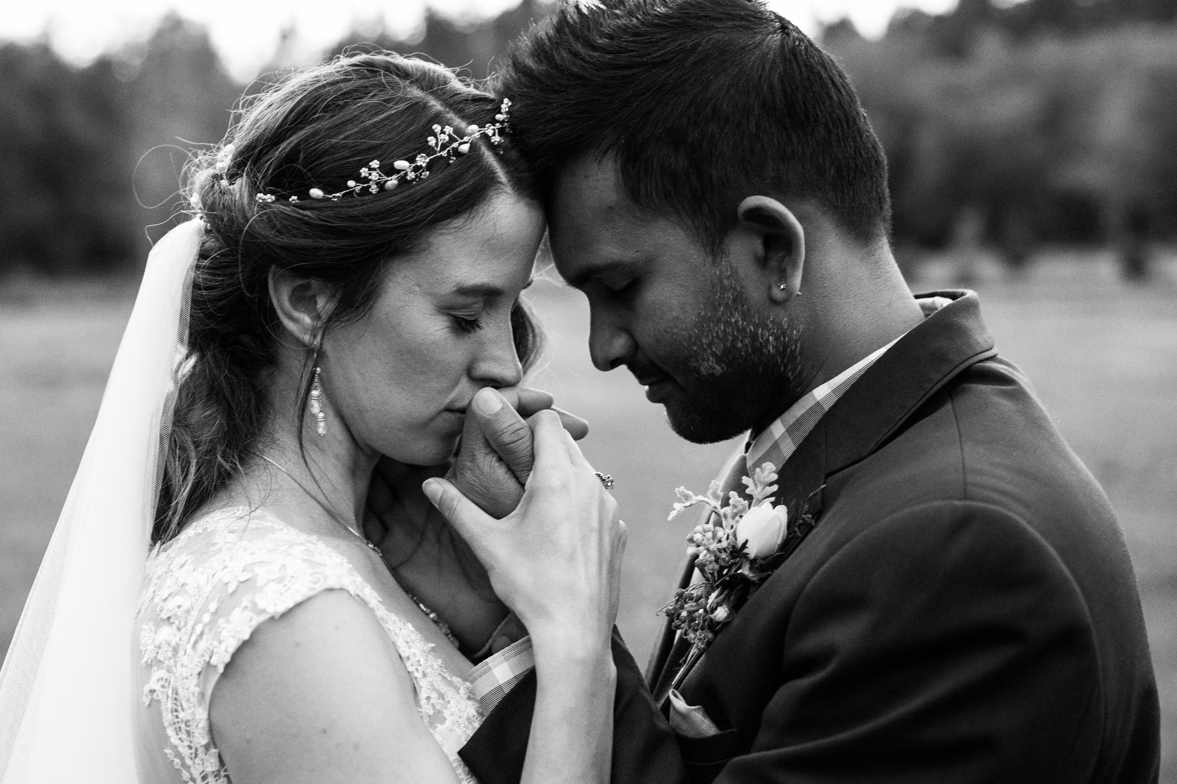 Kohleen and Kash touch foreheads in an intimate black and white portrait