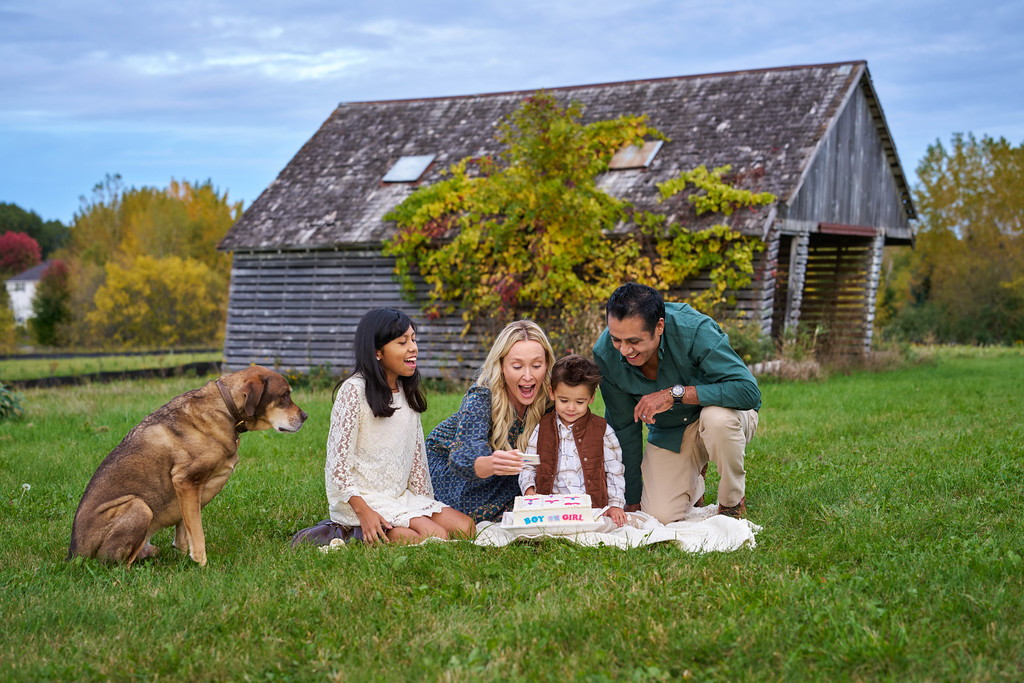 The Zaragoza family reacting to three pink squares on the gender reveal cake at Minnesota Landscape Arboretum, Chaska, Minnesota
